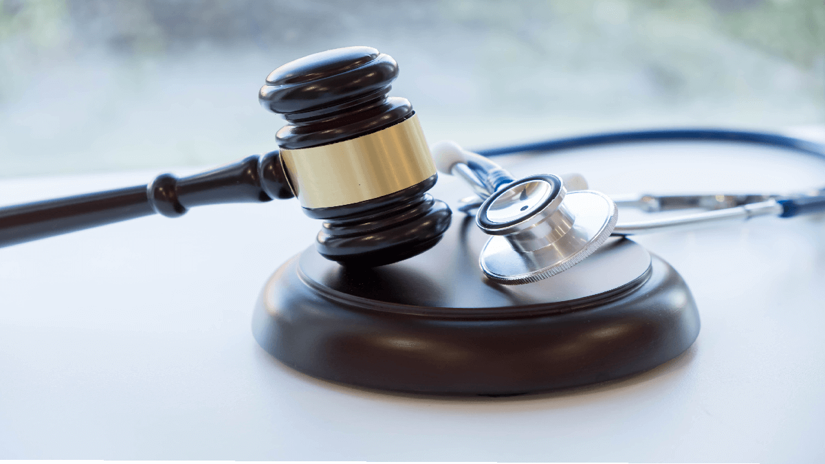 Gavel and mallet with a stethoscope to represent medical malpractice