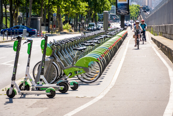 Lime bicycles and scooters in a rack