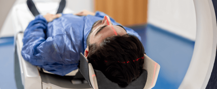 Man getting an MRI brain scan due to a traumatic brain injury case