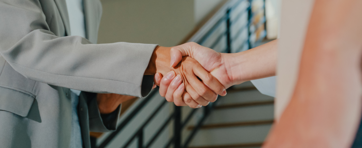Landlord and tenant shaking hands